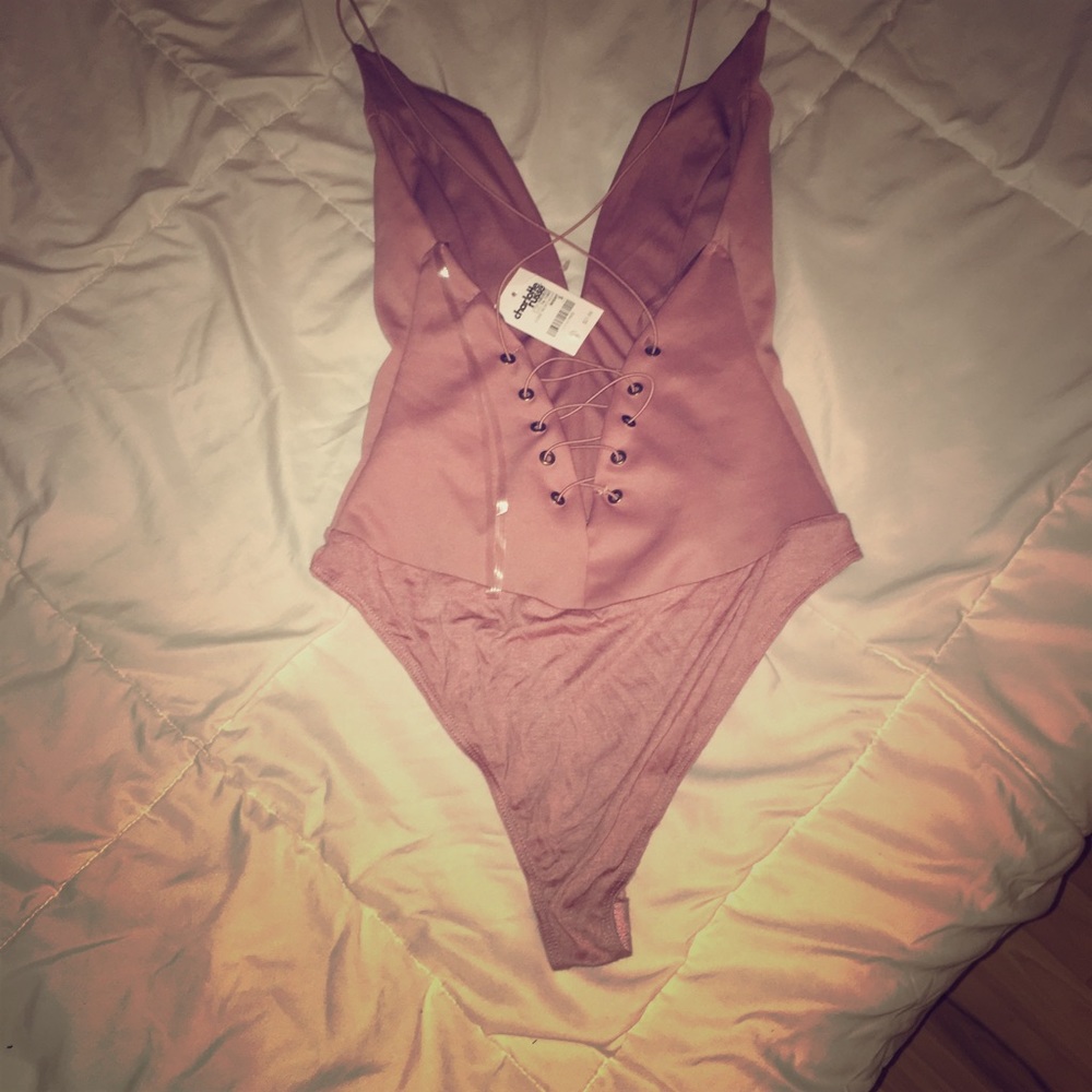 Onesie with low cleavage and open back